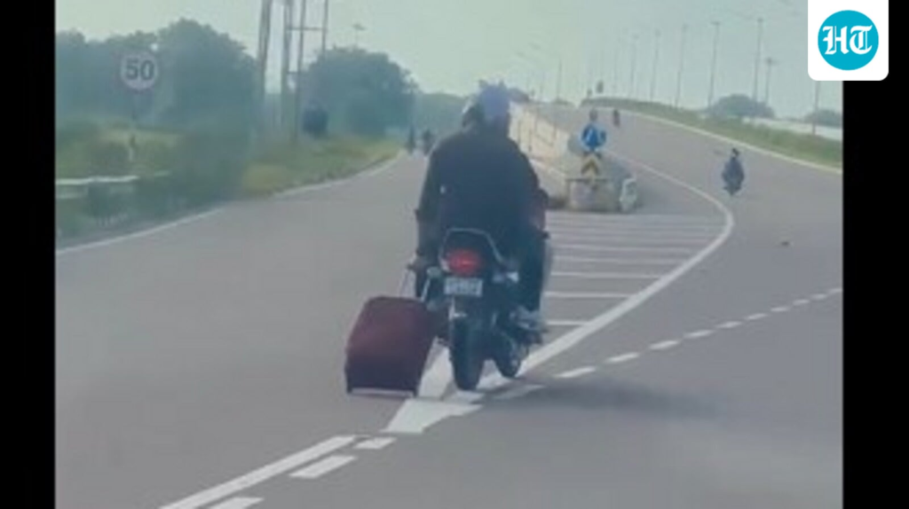 Pillion rider pulls trolley bag behind moving bike on highway, internet stunned. Video